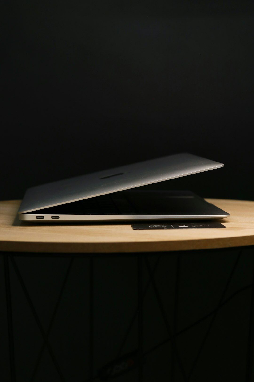Laptop and charts on a table representing market analysis